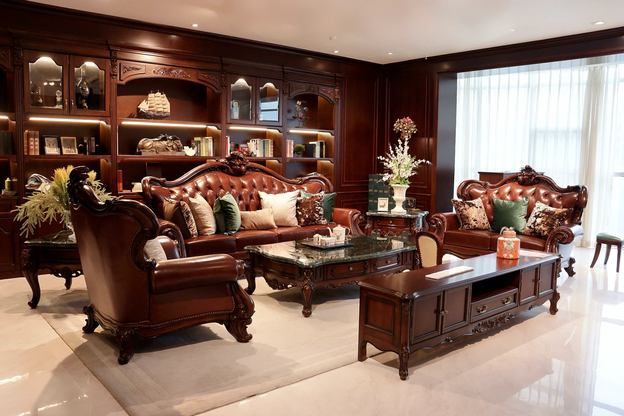 Brown tufted sofas and armchairs with dark carved frames, coffee table and matching console