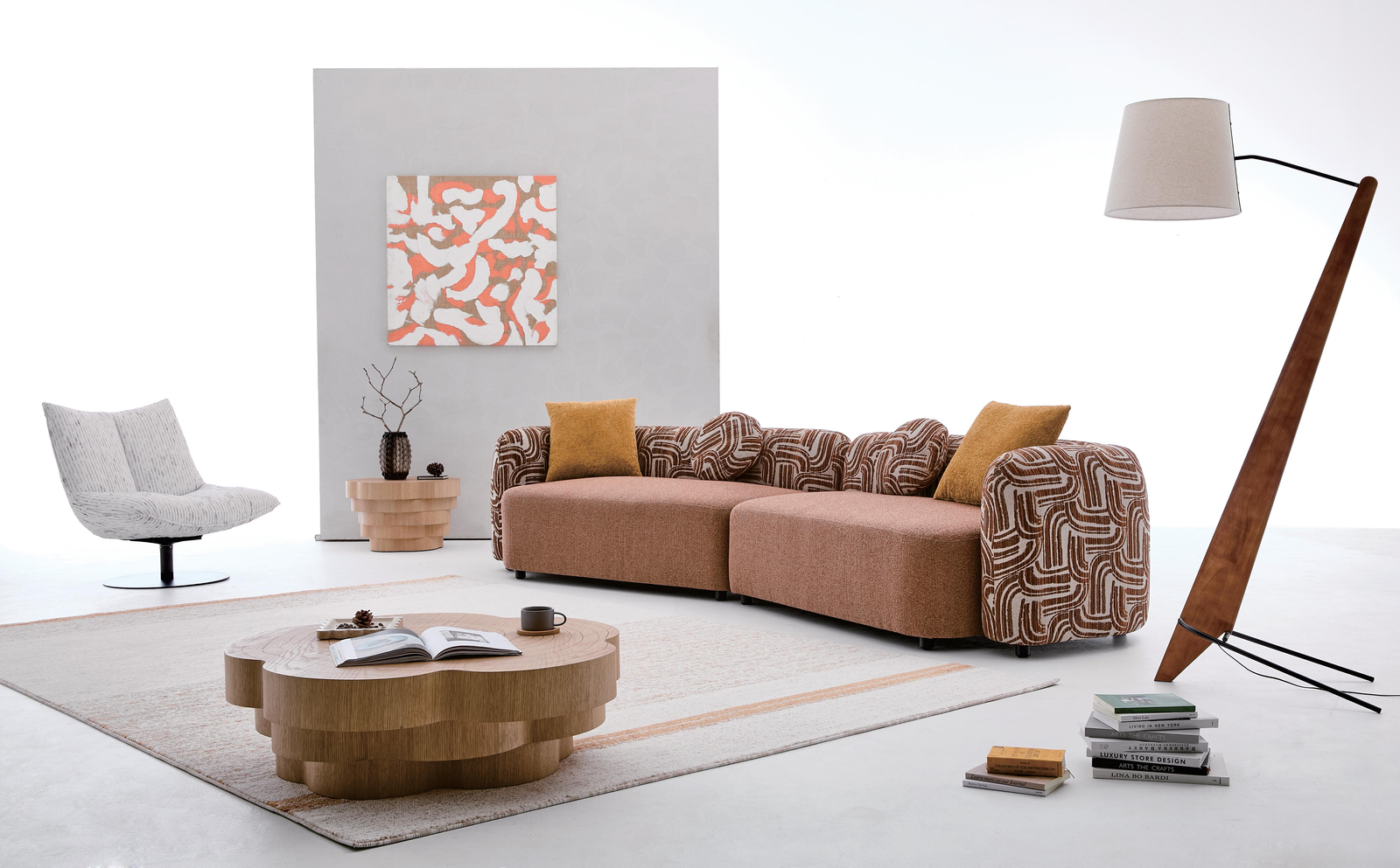 Brown modular sofa with patterned back cushions and rounded arms