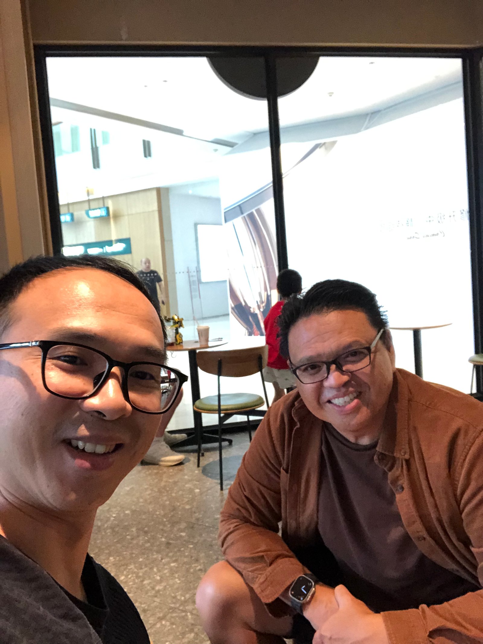 Two people seated indoors during a client visit